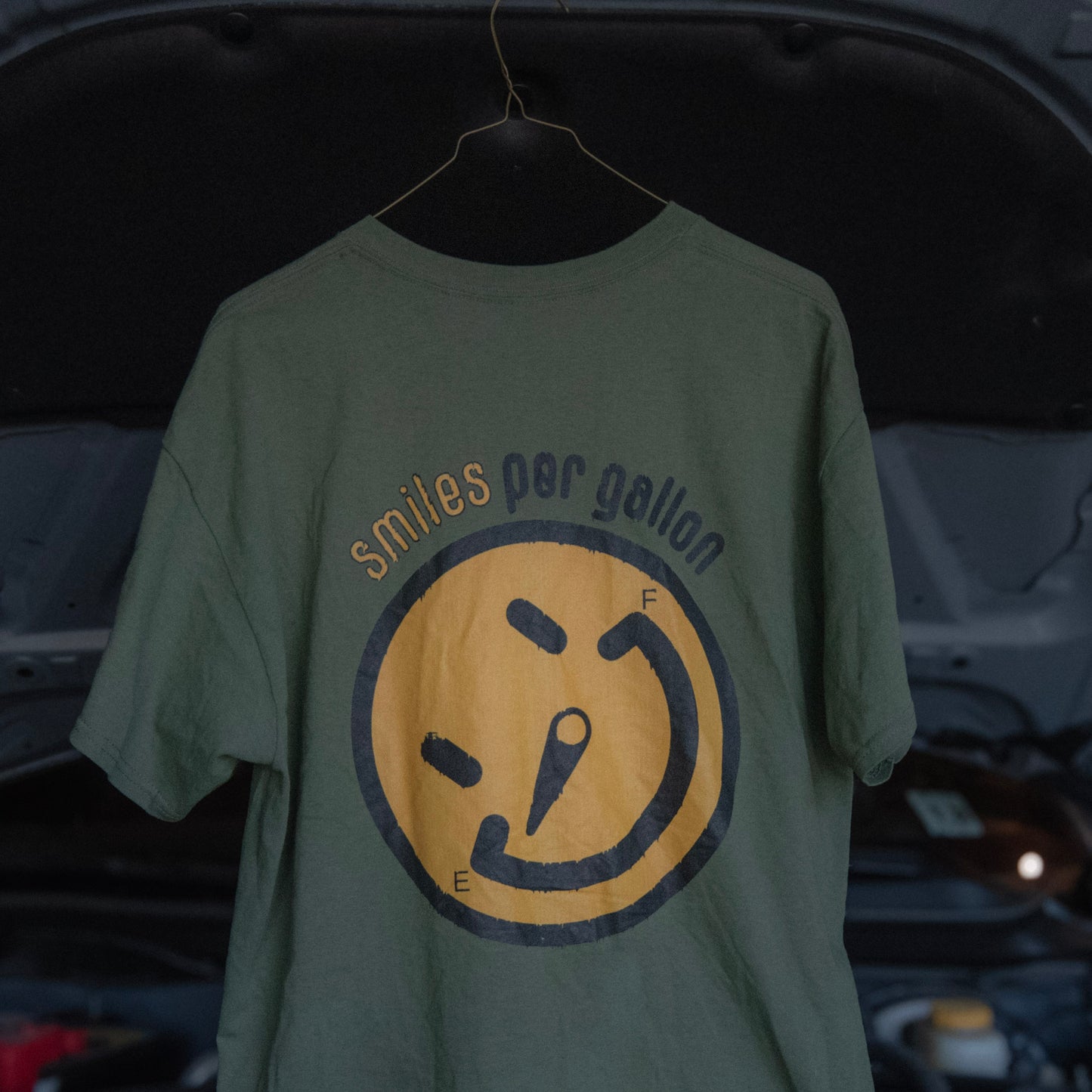 SMILES PER GALLON TEE